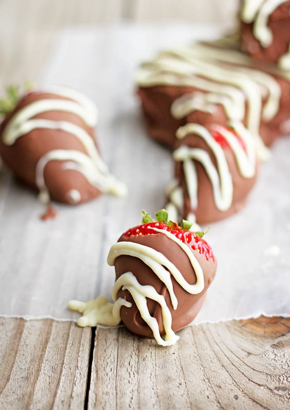 chocolate covered strawberries with white chocolate drizzle.