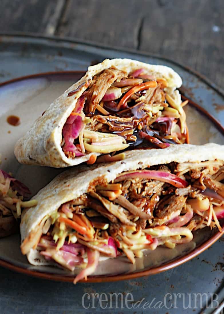 bbq pork pitas with slaw on a plate.