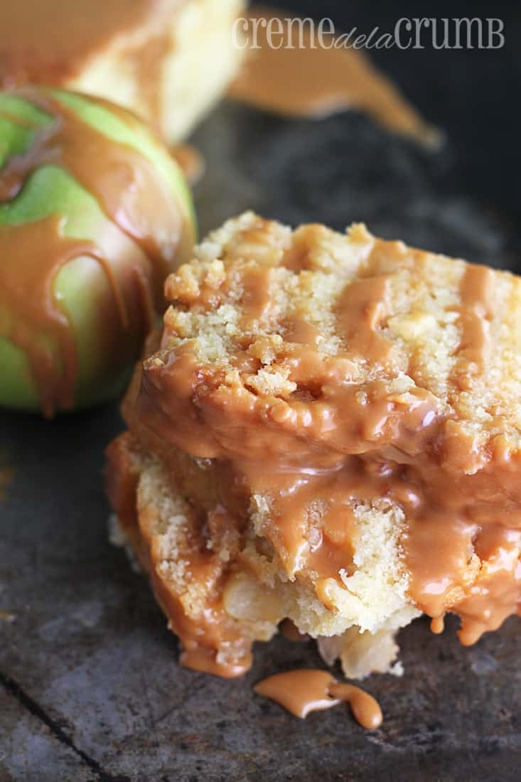 stacked pieces of pound cake with green apple drizzled with caramel on a baking sheet.