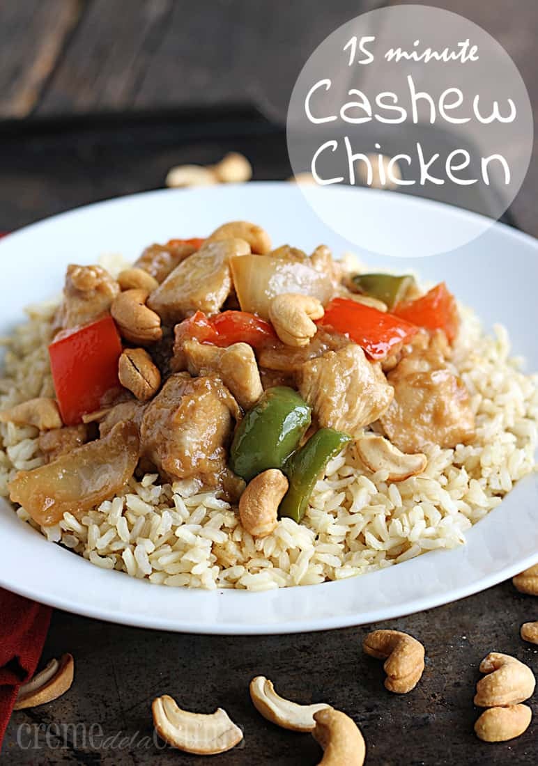 cashew chicken on rice in white bowl with cashews and the title written on the top right of the image.