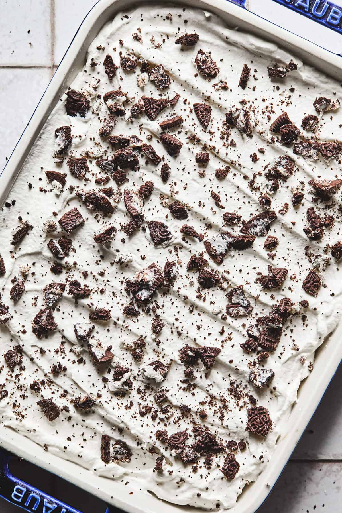 Overhead close up of no bake Oreo ice cream dessert in a pan.