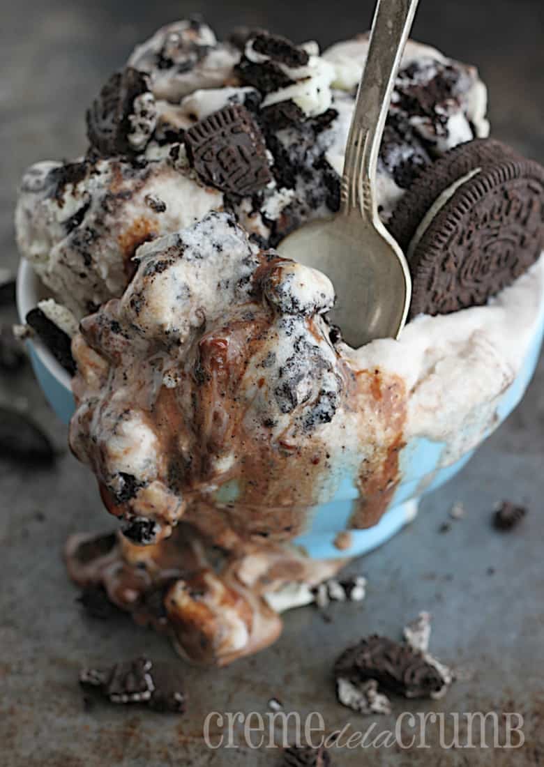 ice cream in a small blue bowl with a spoon.