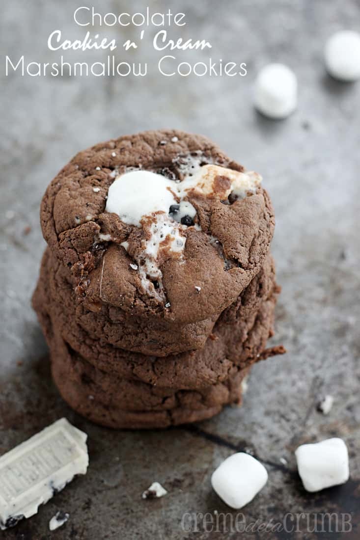 stacked cookies on a baking sheet with a piece of Hershey's cookies n cream bar and marshmallows with the title written on the top left corner of image.