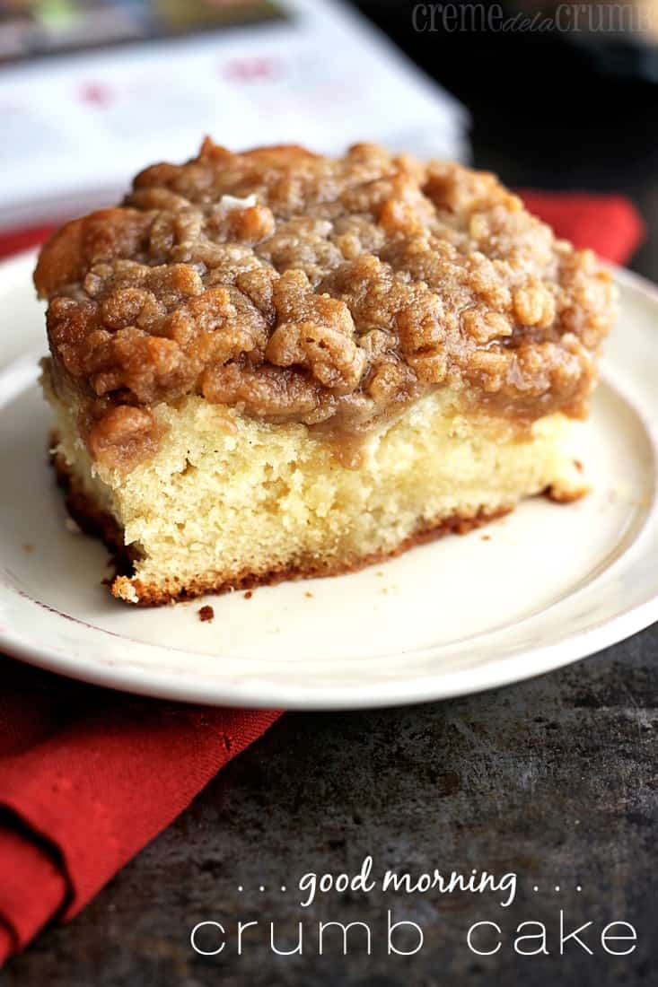 piece of crumb cake on a plate with the title written on the bottom right of the image.