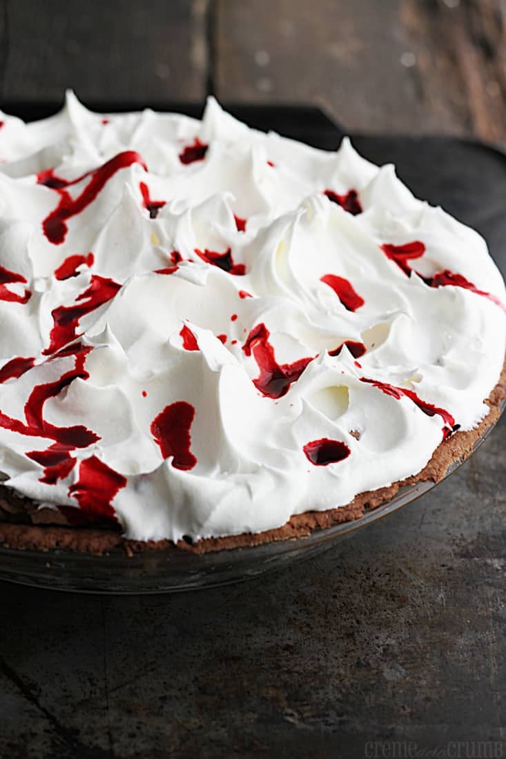 Mississippi blood pie in a pie tin on a baking sheet.