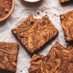 brownies with peanut butter swirl on parchment