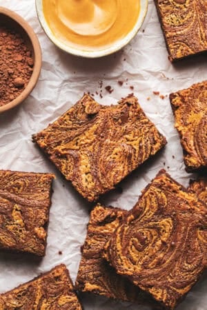 brownies with peanut butter swirl on parchment