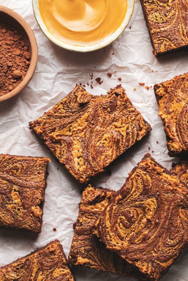 brownies with peanut butter swirl on parchment