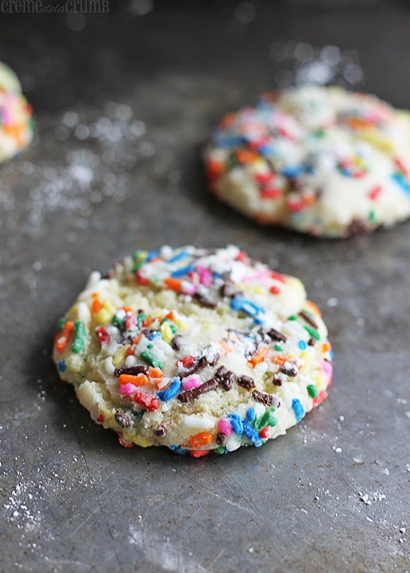 sprinkle crinkle cookies on a baking sheet.