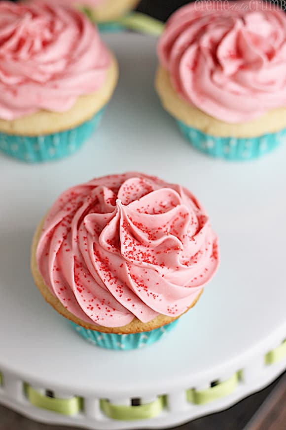 top view of sugar cookie cupcakes on a cake platter.