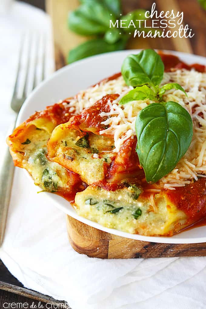 cheesy meatless manicotti on a plate with the title fo the recipe written on the top right corner of the image.