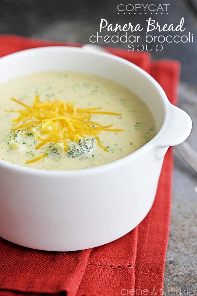 {copycat} Panera Bread cheddar broccoli soup in a bowl on top of a red cloth napkin with the title of the recipe written on the top right corner of the image.