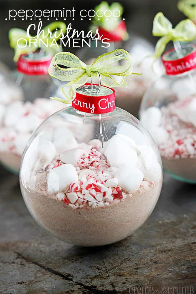 peppermint, cocoa and marshmallows in Christmas ornaments with the title of the recipe written on the top left corner of the image.