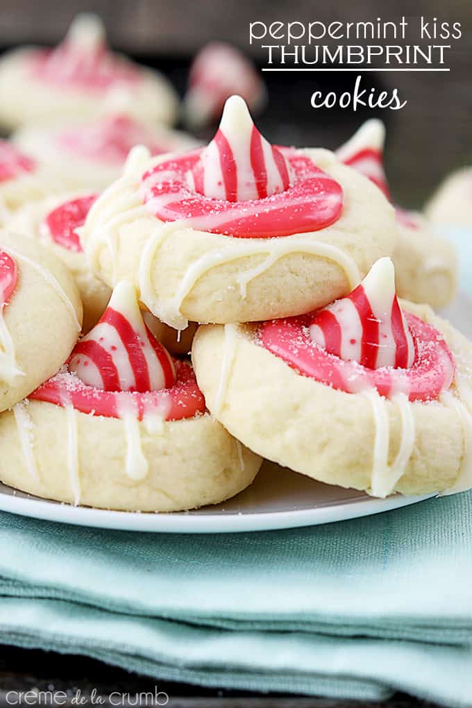 peppermint Kiss thumbprint cookies on a plate on a cloth napkin with the title of the recipe written on the top right corner of the image.
