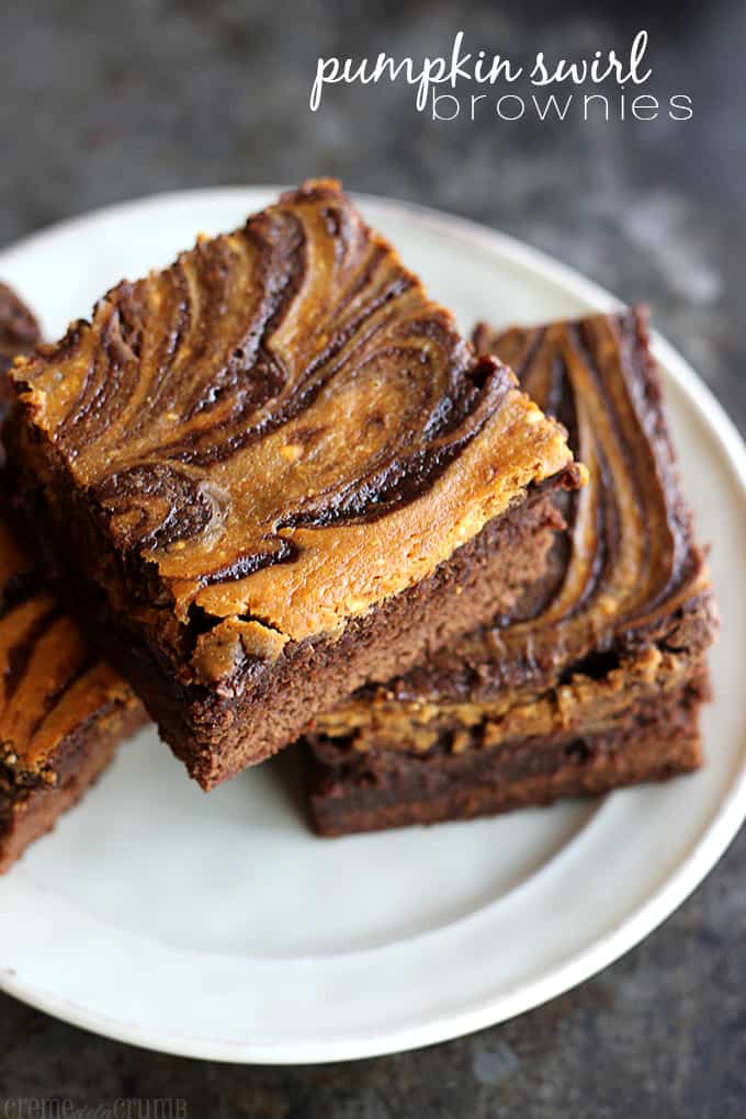 pumpkin swirl brownies on a plate with the title of the recipe written on the top right corner of the image.