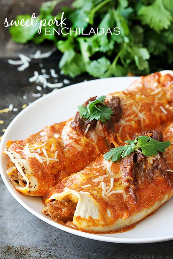 sweet pork enchiladas on a plate with the title of the recipe on the top left corner of the image.