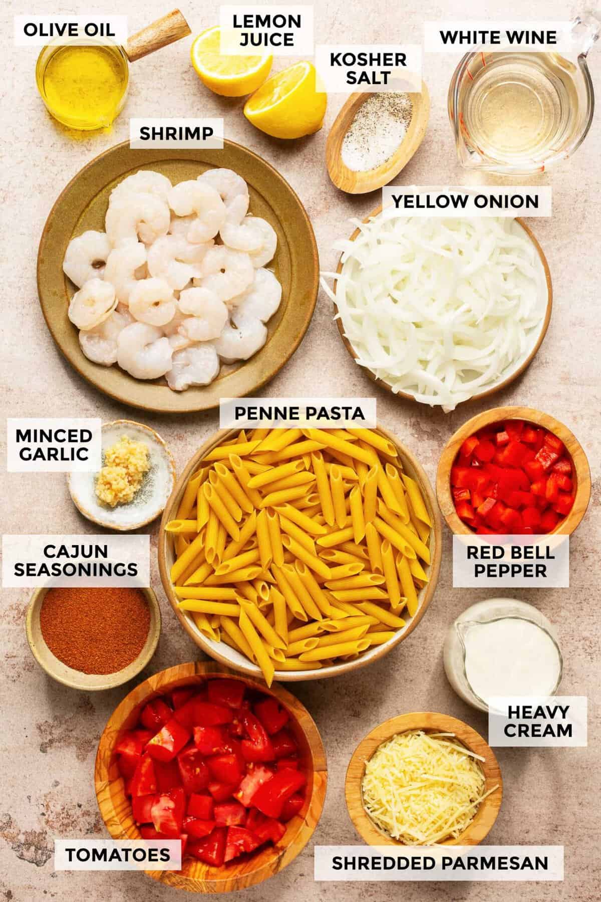 Ingredients for preparing creamy Cajun shrimp pasta.