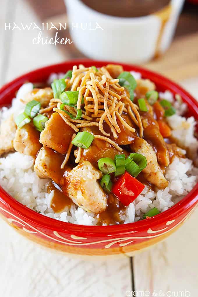 Hawaiian Hula chicken on a rice in a bowl with the title of the recipe written on the top left corner of the image.