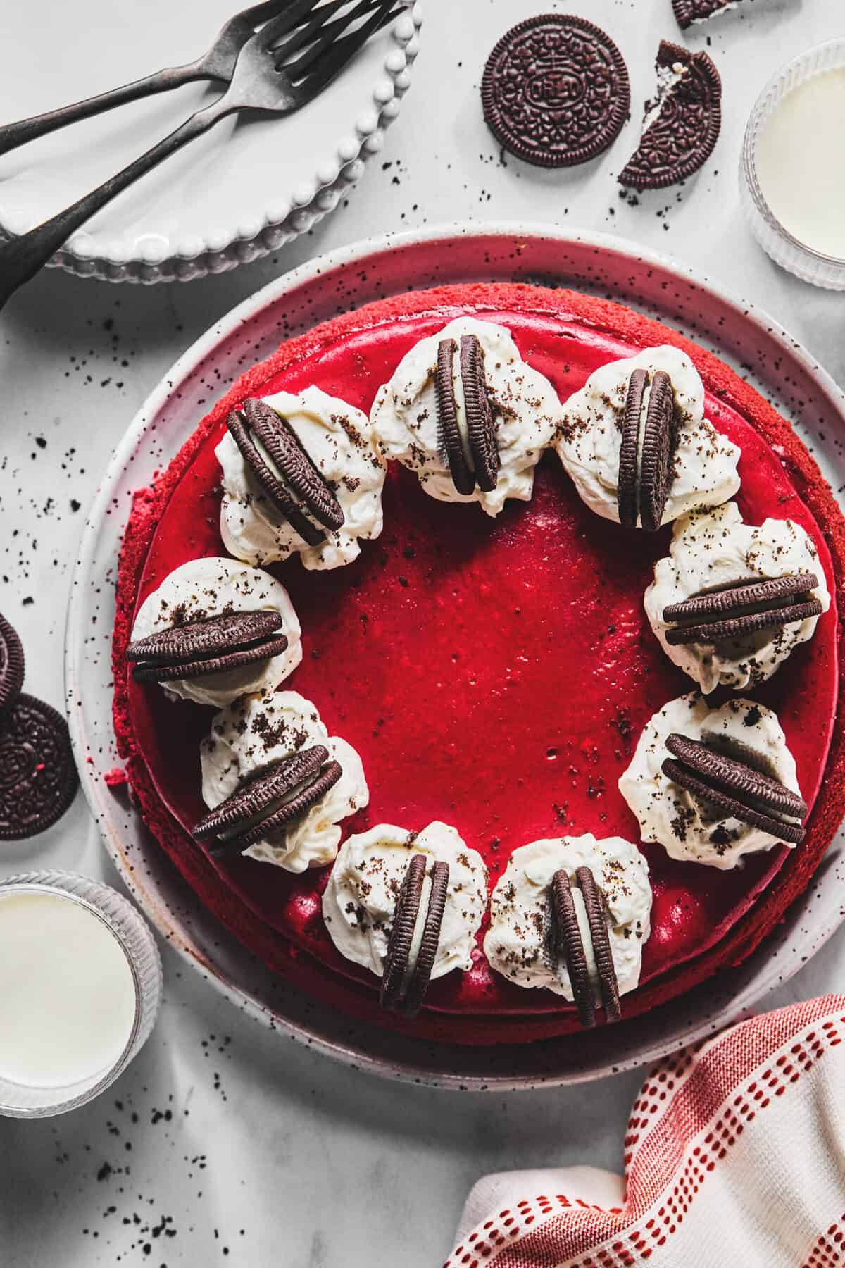 Overhead of a full red velvet cheesecake.