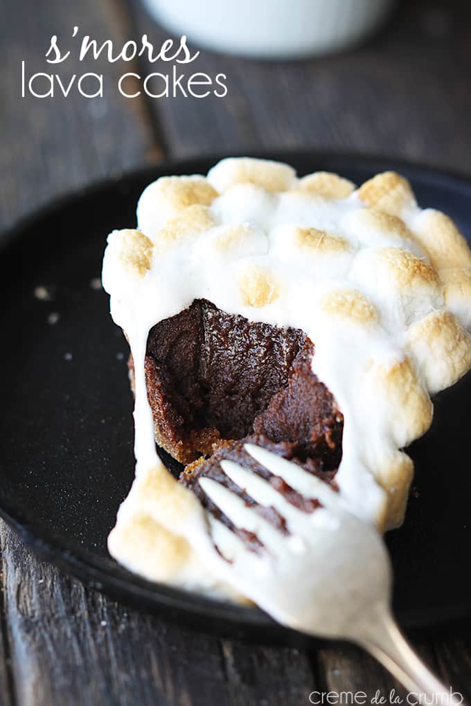 a S'mores lava cake on a plate with a fork taking a bite with the title of the recipe written on the top left corner of the image.