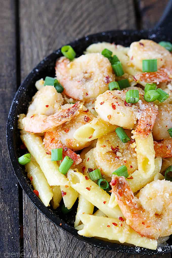 top view of spicy parmesan shrimp pasta in a skillet.
