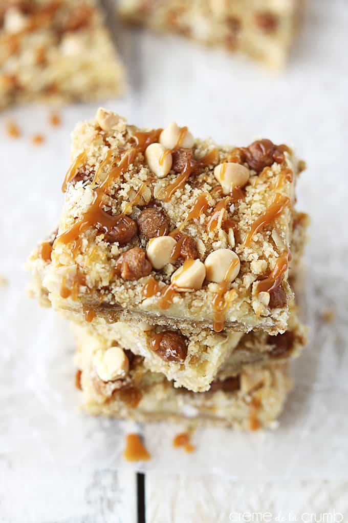 top view of stacked caramel crumble cheesecake bars.