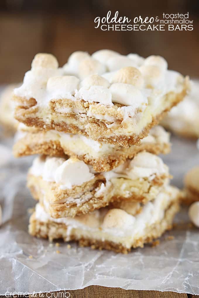 stacked golden Oreo & toasted marshmallow cheesecake bars with the title of the recipe written on the top right corner of the image.