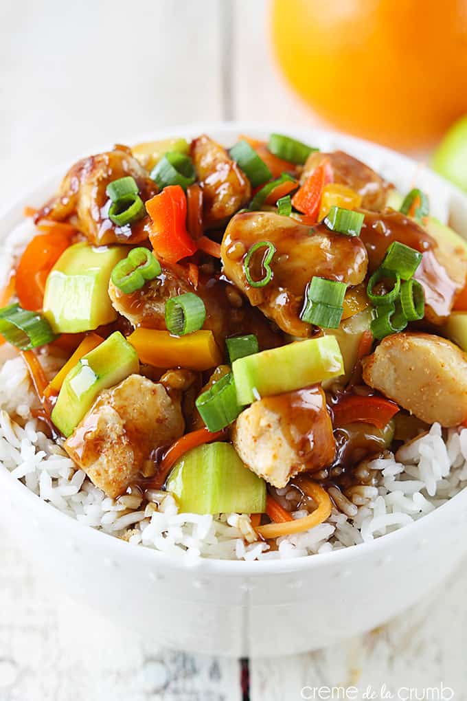 top view of orange teriyaki chicken on rice in a bowl.