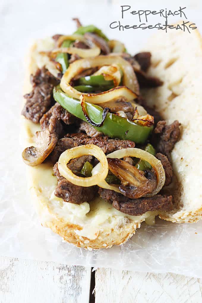 a pepper-jack cheesesteak with the title of the recipe written on the top right corner of the image.