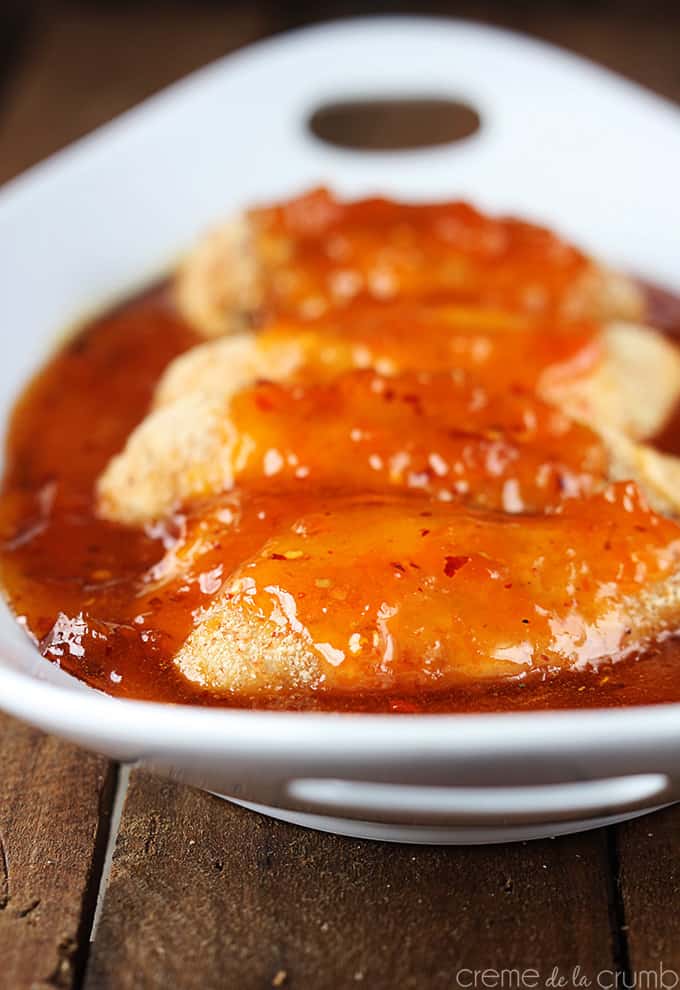 spicy apricot chicken topped with sweet and spicy apricot sauce on a serving tray.