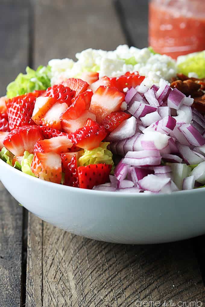 strawberry poppyseed & bacon chopped salad in a bowl.