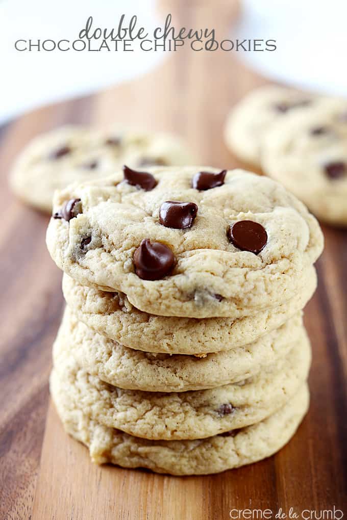 stacked double chewy chocolate chip cookies with the title of the recipe written on the top left side of the image.