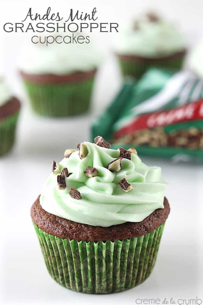 an Andes mint grasshopper cupcake with more cupcakes and an Ande's mint bag faded in the background with the title of the recipe written on the top left corner of the image.