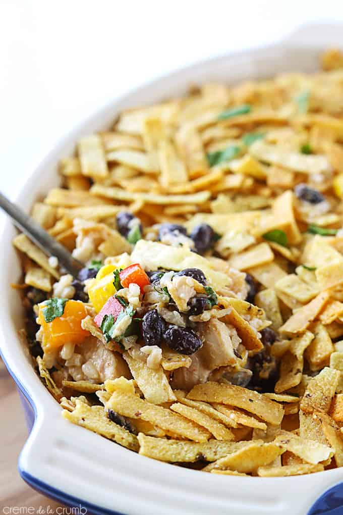 tex mex chicken bake with a spoon in a serving tray.