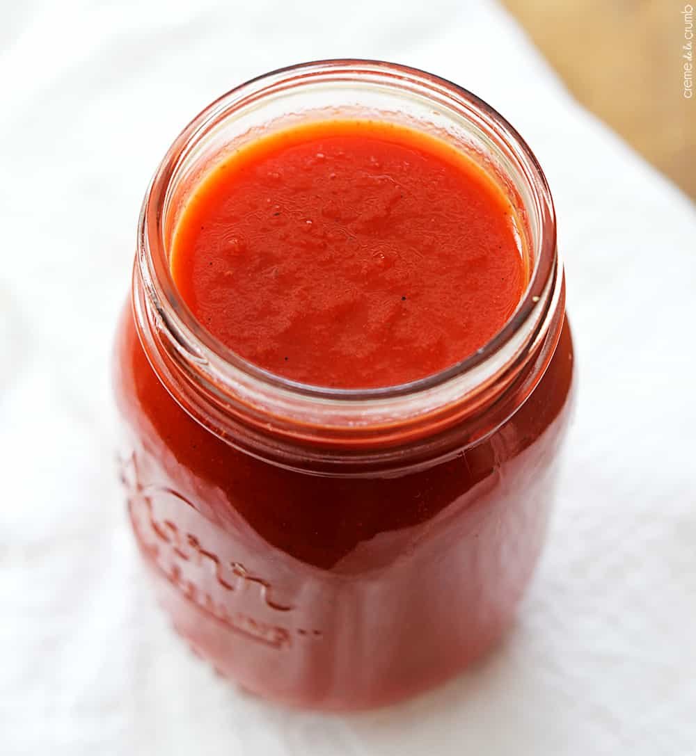 top view of homemade red enchilada sauce in a mason jar.