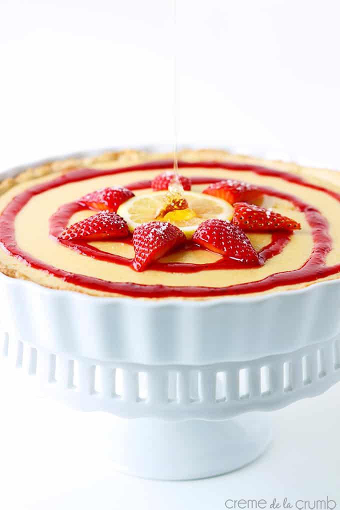 honey lemon & strawberry tart in a pedestal dish.