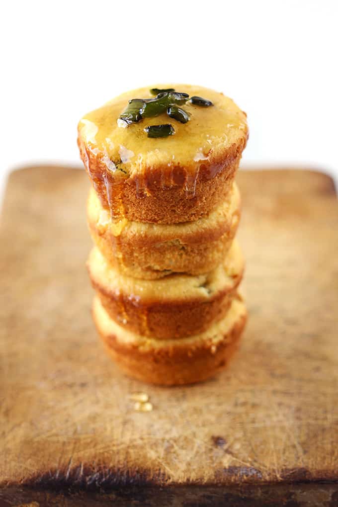 stacked honey poblano corn muffins drizzled with honey.