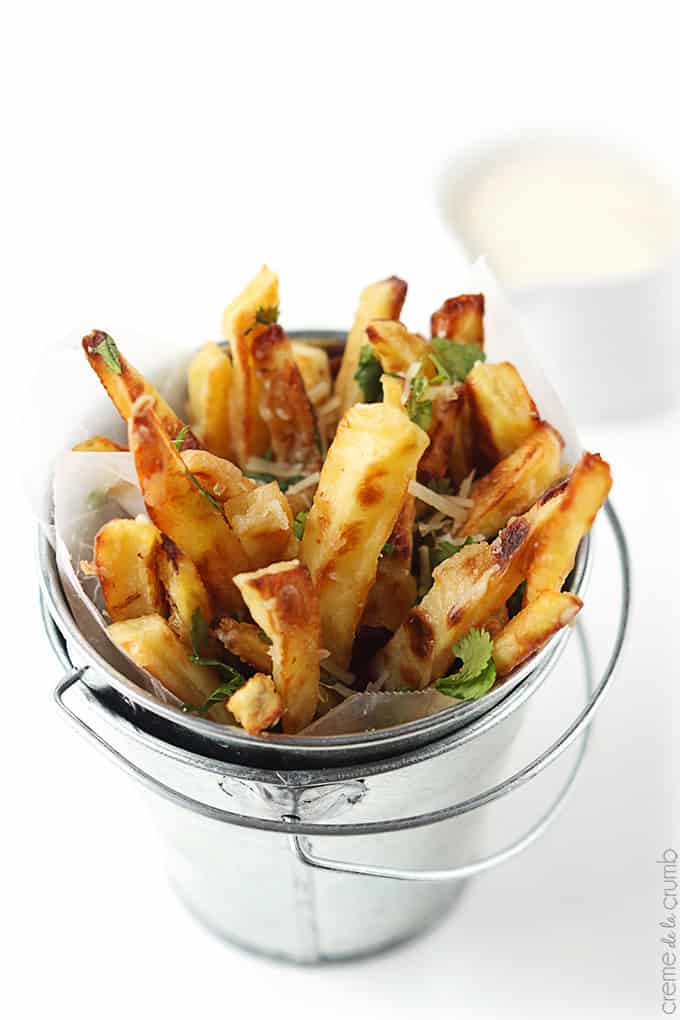 top view of garlic parmesan oven fries in a small metal bucket.