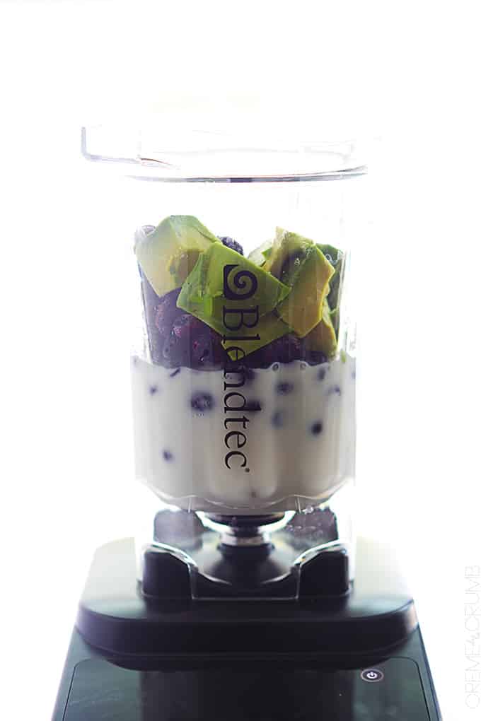 blueberry smoothie ingredients in a blender.