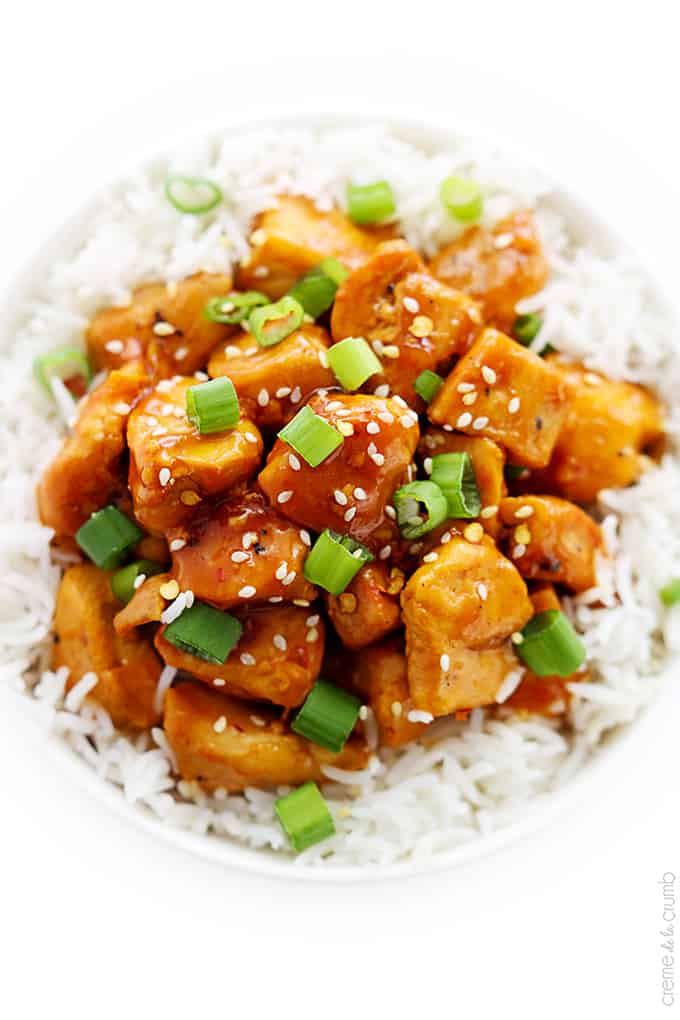 top view of orange chicken on rice in a bowl.