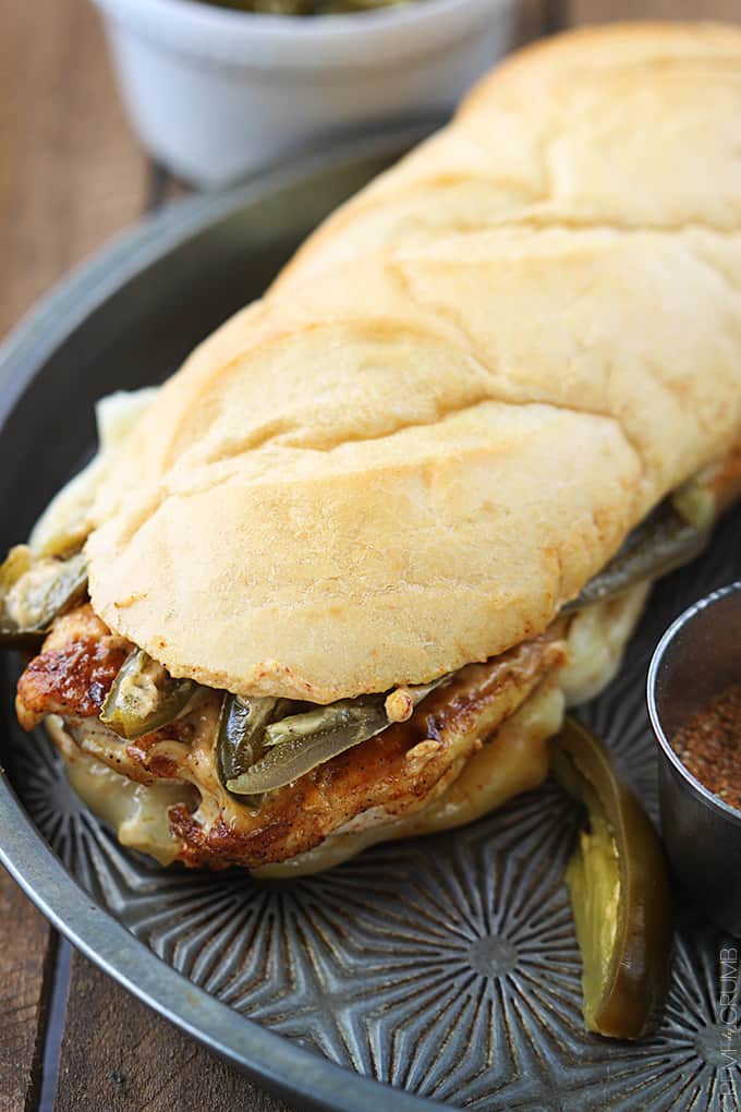 close up of a fiery jalapeño chicken melt on a serving tray.