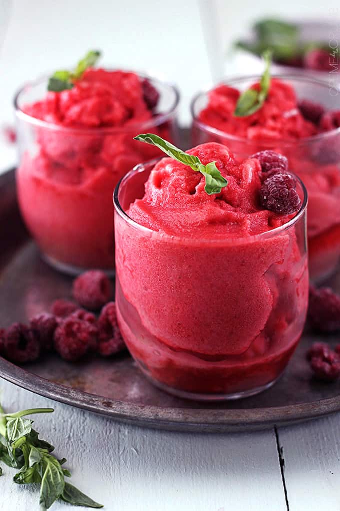 glasses of raspberry sorbet on a metal plate.