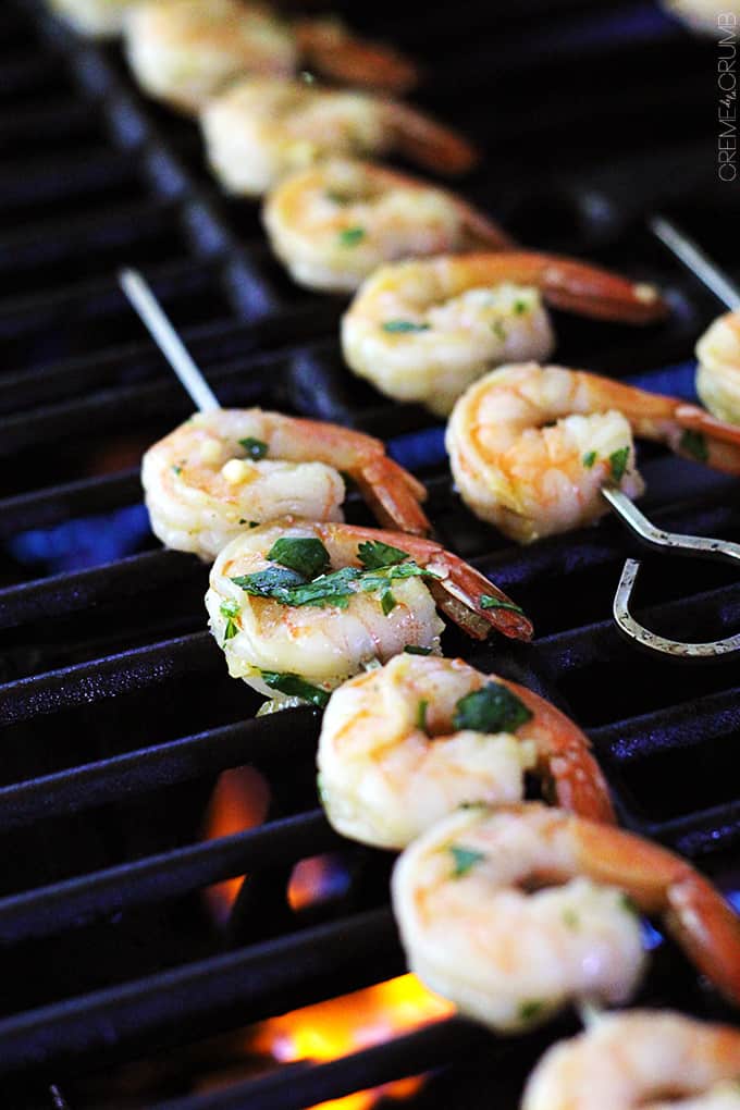 cilantro lime grilled shrimp skewers on a grill.