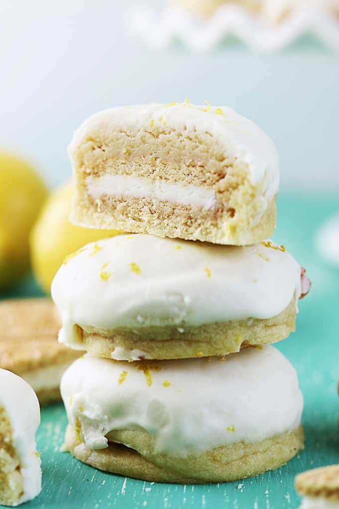 stacked golden Oreo stuffed lemon cookies with half of a cookie on the top.