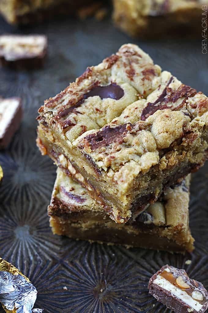 top view of two kerplunky bars stacked with snicker pieces around it.