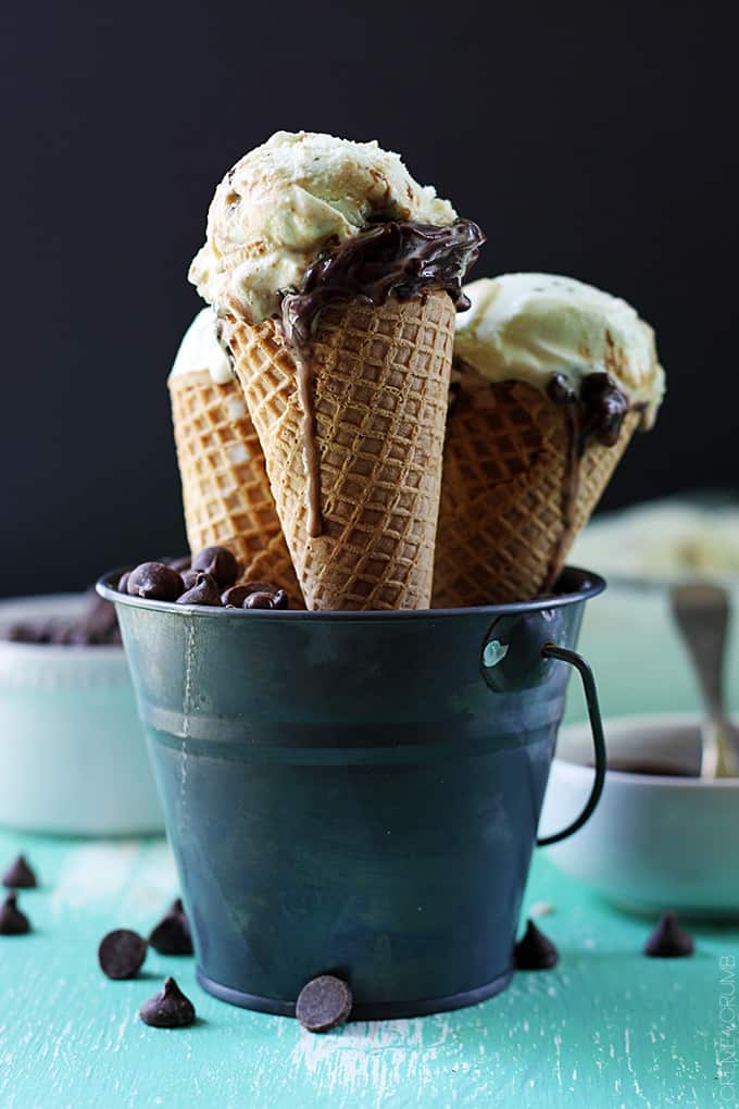 hot fudge ripple mint chocolate chip ice cream cones in a metal tin.