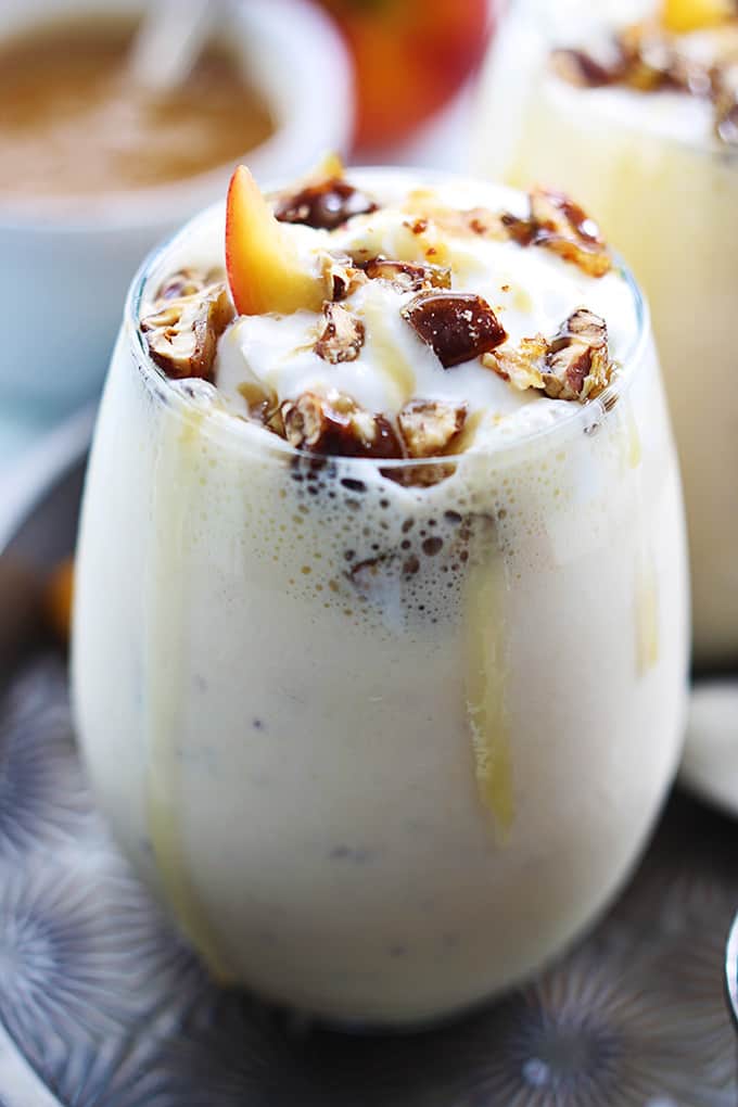 a peaches n' cream caramel pecan milkshake in a glass.