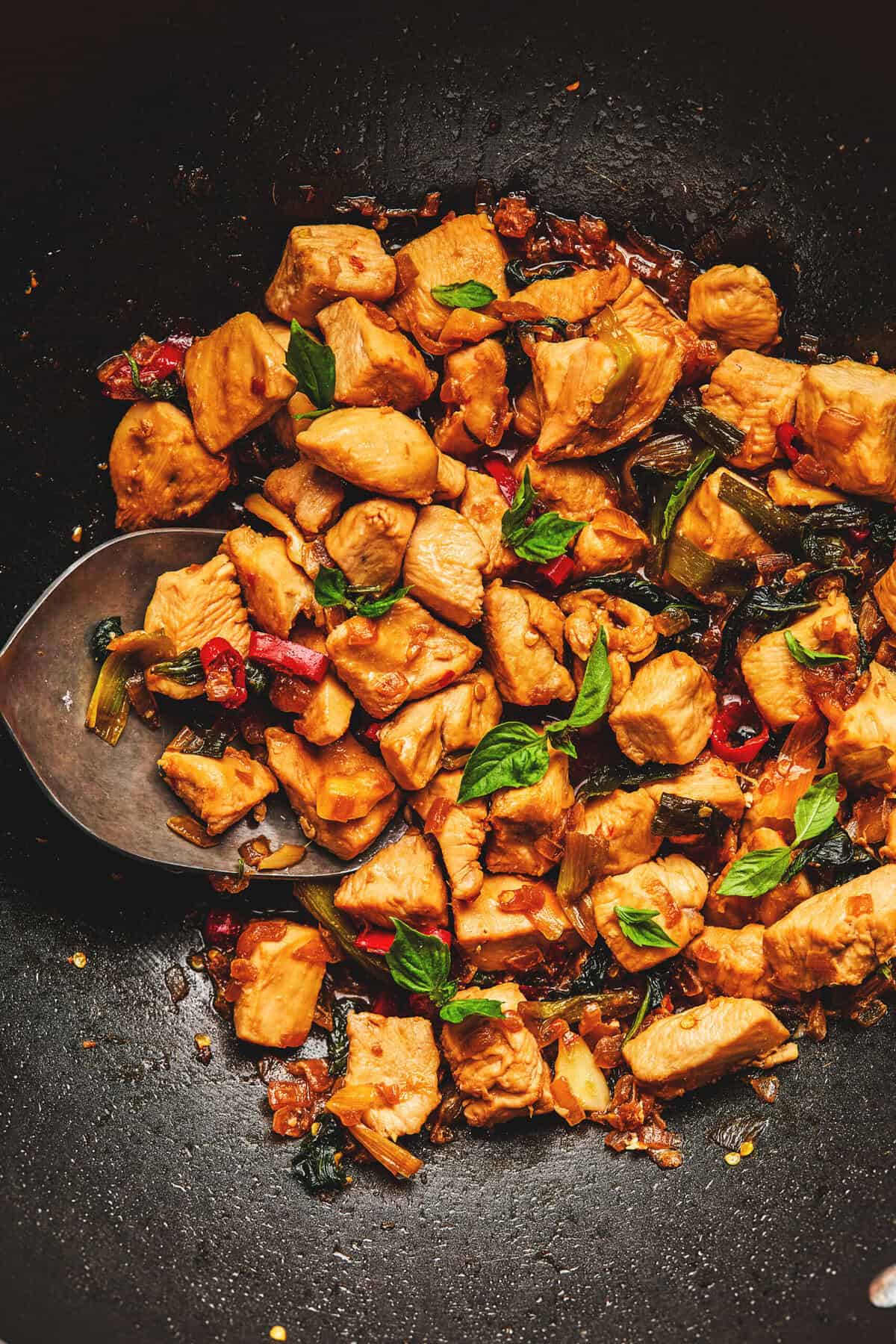 thai chicken with basil in skillet