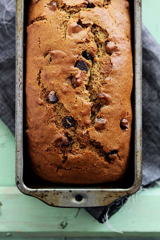 top view of a loaf of browned butter chocolate chip pumpkin bread in a bread pan.