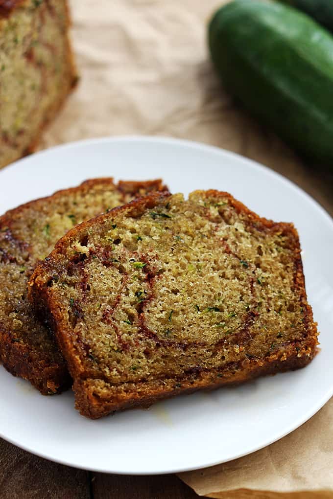 slices of cinnamon swirl zucchini bread on a plate.